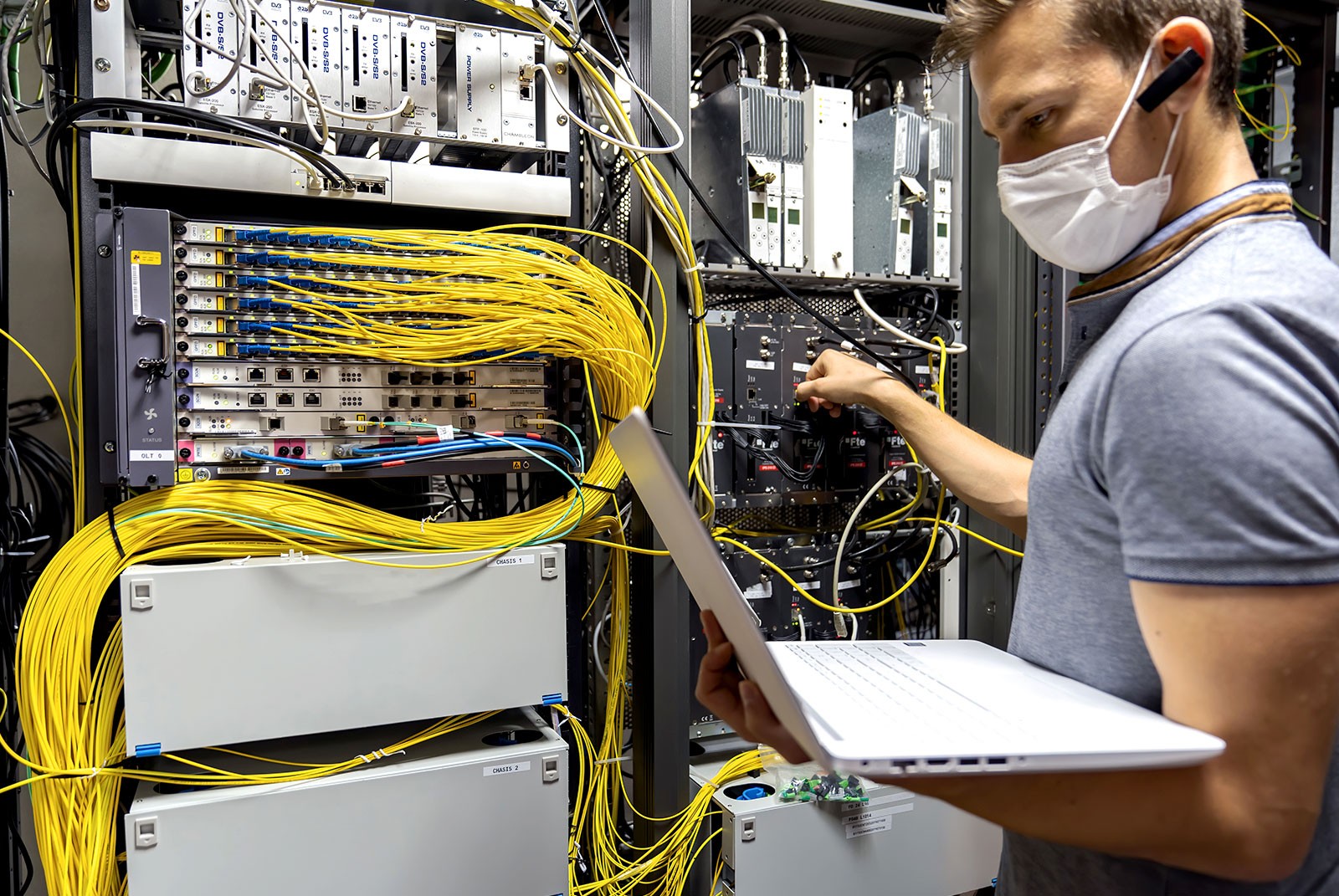 data electrician man fixing servers