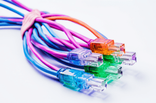 Colorful Ethernet cables bundled together against a white background.