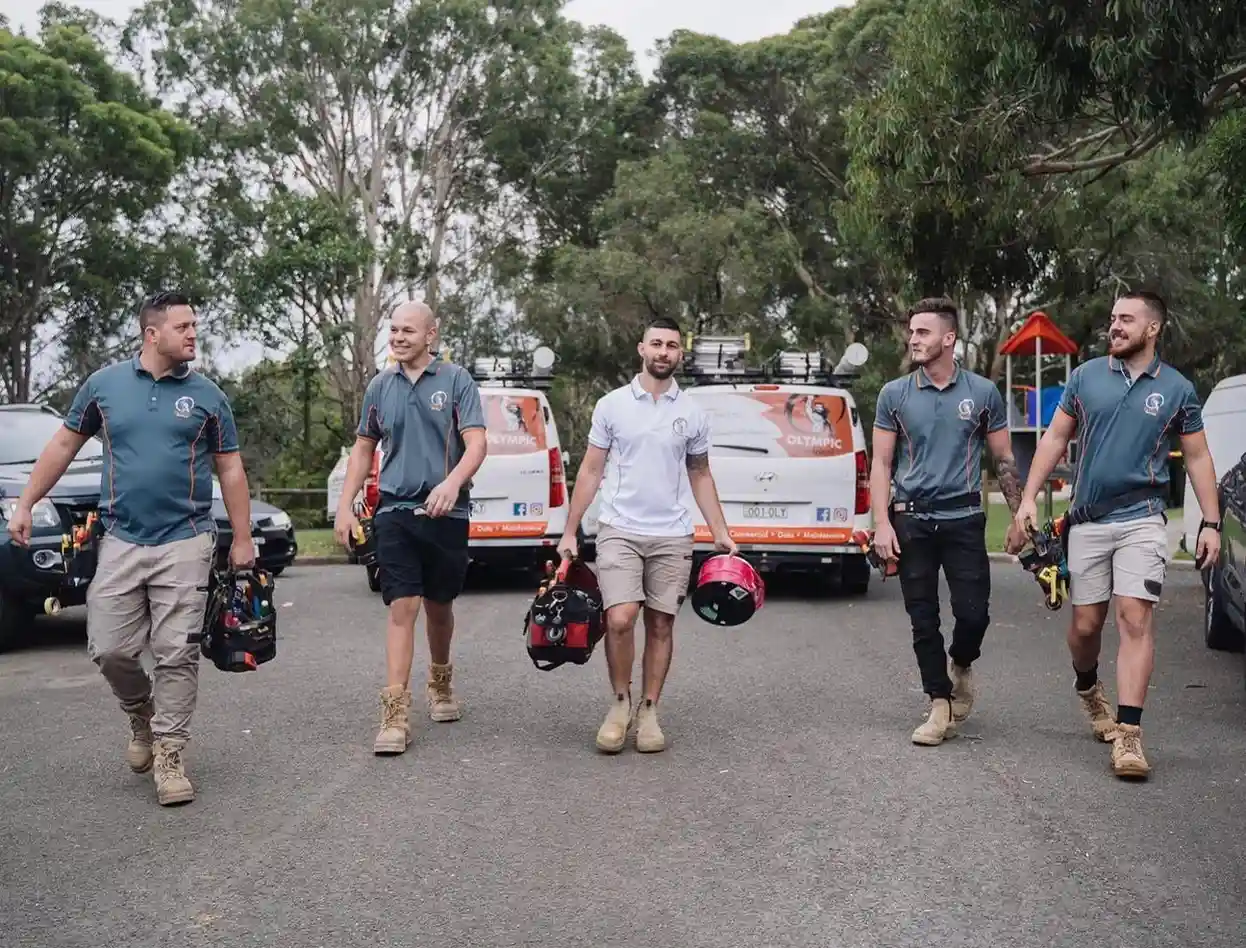 Electricians team with tools outdoors